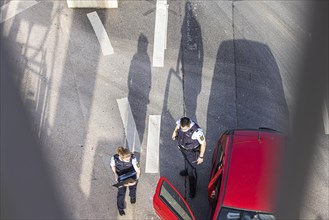 Police officers during a vehicle check with a laptop, Stuttgart, Baden-Wuerttemberg, Germany, Europe