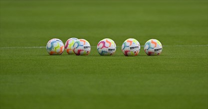 Adidas Derbystar match balls lie on grass, Allianz Arena, Munich, Bavaria, Germany, Europe