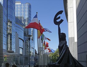 Statue of Europe with euro symbol, flags of EU member states, Rue Wiertz, European Parliament, Brussels, Belgium, Europe