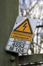 High voltage danger to life, warning sign on an overhead line electricity pylon, Duisburg, North Rhine-Westphalia, Germany, Europe