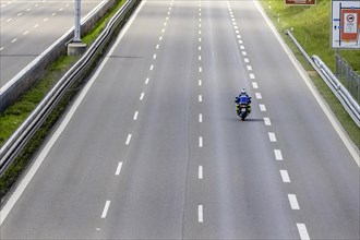 Empty lanes on the A8 motorway, exit restrictions because of the Corona make for empty roads, police motorbike Stuttgart, Baden-Wuerttemberg, Germany, Europe