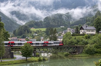 OeBB passenger train on the Kronprinz Rudolfbahn on the bridge over the Enns in Reichraming, Upper Austria, Austria, Europe
