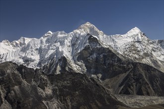 View from Chukhung Ri, a trekking peak located in the upper part of the Imja Khola valley. Imja Tse, known as Island Peak, the popular 6000-metres-plus peak, is just ahead. Makalu, the worlds sixth-hi...