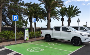 Green parking area with Iberdrola charging station for electric car, Lanzarote, Canary Islands, Spain, Europe