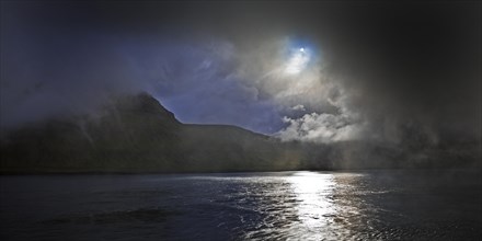 The island of Kalsoy in the North Atlantic with dramatic light mood of sun and clouds, Faroe Islands, Foroyar, Denmark, Europe