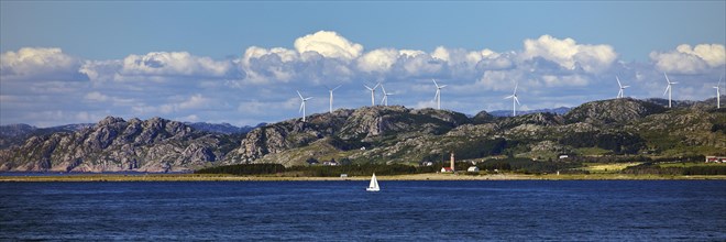 North Sea with coastal landscape, sailboat and Lista fyr lighthouse, Lista peninsula, Steinodden, Norway, Europe