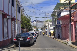 Street with colonial houses and cruise ship in Centro Historico, Old Town of Puerto Plata, Dominican Republic, Caribbean, Central America