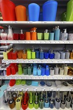 Shelf with colourful soap dispensers and toilet brushes in a DIY store, Allgaeu, Bavaria, Germany, Europe