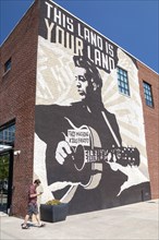Tulsa, Oklahoma, The Woody Guthrie Center, a museum and archive devoted to the folk musician. The center also contains the archives of Phil Ochs