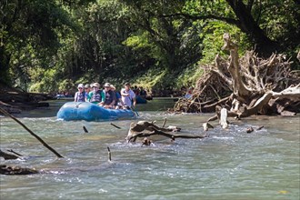 Muelle San Carlos, Costa Rica, Tourists on a scenic rafting trip on the Rio Penas Blancas, Central America