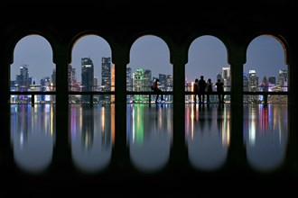 View of the illuminated skyline of Doha, Qatar, from the terrace of the Museum of Islamic Art by the archtics Ieoh Ming Pei and Jean-Michel Wilmotte, Asia