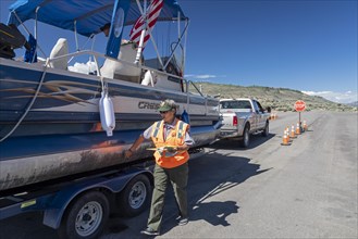 Gunnison, Colorado, Carol Soell, a boat inspector at Curecanti National Recreation Area, checks boats entering and leaving Blue Mesa Reservoir for invasive species. Colorados mandatory inspection prog...
