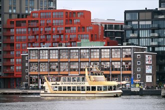 Pannekoeken boat in front of colourful buildings, NDSM Plein, Amsterdam, Netherlands