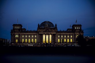 The evening sky is reflected in the windows of the Reichstag building on an evening in autumn. Berlin, Berlin, Germany, Europe
