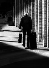 Black and white photography, senior citizen with suitcase, Berlin, Germany, Europe