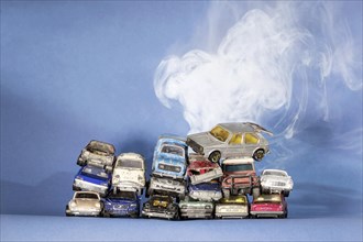Symbol photo scrap cars, broken Matchbox toy vehicles, climate change, studio shot, Germany, Europe