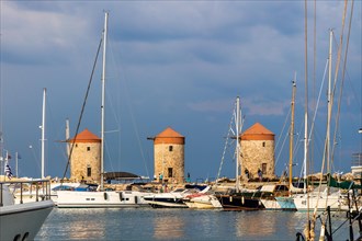 Three windmills on the pier, Mandraki Harbour, Rhodes Town, Greece, Europe