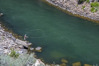 Cimmaron, Colorado, A fly fisherman below Morrow Point Dam on the Gunnison River in Curecanti National Recreation Area