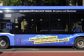 Advertisement for e-mobility on an electric bus, e-bus of MVG, Muenchner Verkehrsgesellschaft, side view, Munich, Bavaria, Germany, Europe
