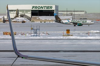 Denver, Colorado, A Frontier Airlines jet on the ground after a snowstorm at Denver International Airport