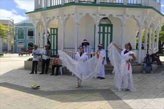 Local dance group with musicians for tourists, in the Parque Independenzia in the Centro Historico, Old Town of Puerto Plata, Dominican Republic, Caribbean, Central America