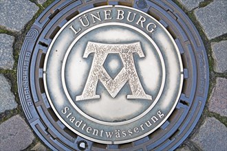 Manhole cover, coat of arms, city drainage, Lueneburg, Lower Saxony, Germany, Europe
