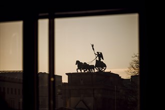 The Quadriga on the Brandenburg Gate is illuminated by the sun in the morning. Berlin, 19.01.2023, Berlin, Germany, Europe