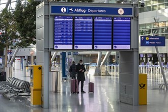 Duesseldorf Airport, DUS, departure hall, terminal, display board, Airport International in lockdown during Corona crisis, hardly any traffic and only few departure connections due to travel restricti...