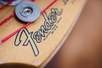 Symbolic photo: The logo of the guitar manufacturer Fender can be seen on a bass. Berlin, 03.03.2023, Berlin, Germany, Europe