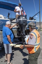 Gunnison, Colorado, Carol Soell, a boat inspector at Curecanti National Recreation Area, checks boats entering and leaving Blue Mesa Reservoir for invasive species. Colorados mandatory inspection prog...