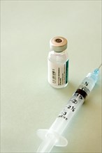Vaccine phial and syringe