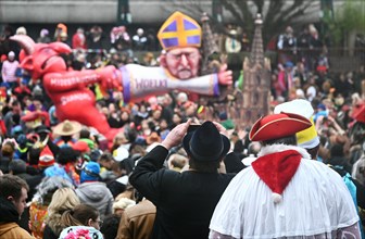 Theme floats by Jaques Tilly: Abuse scandal in the Catholic Church surrounding Cardinal Rainer Maria Woelki, Rosenmontagszug in Duesseldorf, North Rhine-Westphalia