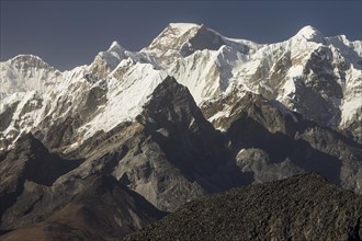 Mountains of the Mahalangur Himal seen from a distant place above the Ama Dablam Base Camp. Gyachung Kang is the highest mountain below 8000 metres, Hillary Peak honours Sir Edmund Hillary, the first ...