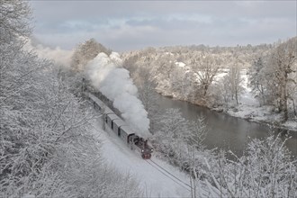 Winter steam locomotive ride of the Steyrtalbahn museum railway along the river Steyr, Upper Austria, Austria, Europe