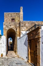 Captains house in the winding streets with white houses, Lindos, Rhodes, Greece, Europe