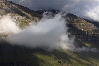 Cloud with dramatic light mood on the west coast of the North AtlanticIsland Kunoy, Faroe Islands, Foroyar, Europe