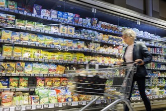 Elderly woman shopping in supermarket, Radevormwald, Germany, Europe