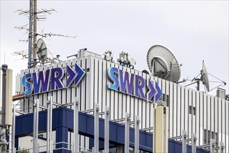 Suedwestrundfunk, SWR broadcasting house with logo and satellite antennas, exterior view of the public broadcaster, Neckarstrasse, Stuttgart, Baden-Wuerttemberg, Germany, Europe