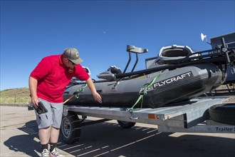 Evanston, Wyoming, An employee of the Wyoming Game & Fish Department inspects watercraft at a mandatory inspection station along the Utah border. The intent is to keep invasive aquatic species, includ...
