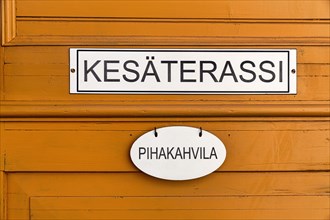Signs on an old wooden door, inscription Summer Terrace, Cafe Terrace, Finnish, Old Town of Rauma, UNESCO World Heritage Site, Satakunta, Finland, Europe