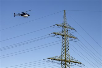 Helicopter control flight, overhead line, power line, helicopter, Grevenbroich, North Rhine-Westphalia, Germany, Europe