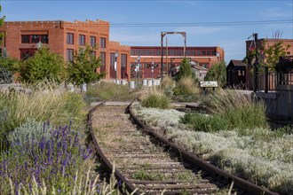 Evanston, Wyoming, The historic roundhouse and railyards, built by the Union Pacific Railroad in 1912. The building had 28 bays for railcar and locomotive repair, with curved walls 30 feet high. UPRR ...