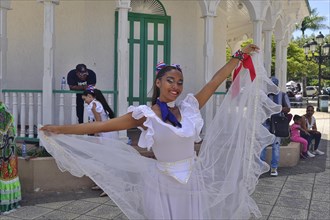 Dancer of the local dance group with musicians for tourists, in the Parque Independenzia in the Centro Historico, Old Town of Puerto Plata, Dominican Republic, Caribbean, Central America