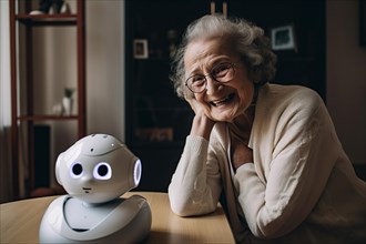 An elderly woman in a retirement home has fun with a nursing robot