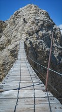 Tourist on the suspension bridge in Monte Cristallo
