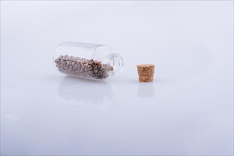 Little perfume glass bottle on a white background