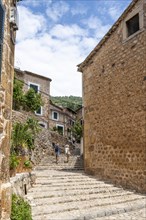 Alley with stairs and typical stone houses