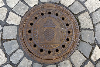 Manhole cover with the Augsburg city coat of arms