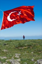 Turkish national flag with white star and moon in air