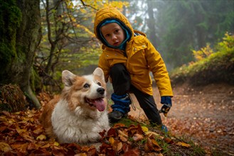 Child on the mountain trail. They are accompanied by a dog. Polish mountains